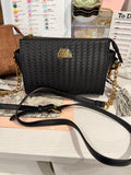 Steve Madden black woven crossbody bag with gold chain strap and tassel charm